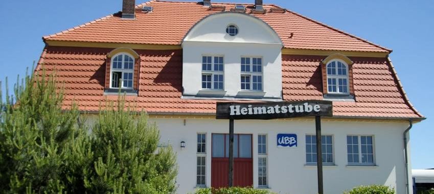 Logo von Bahnhofsgebäude mit Heimatstube